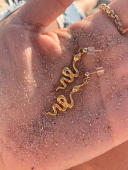 she charms snakes earrings